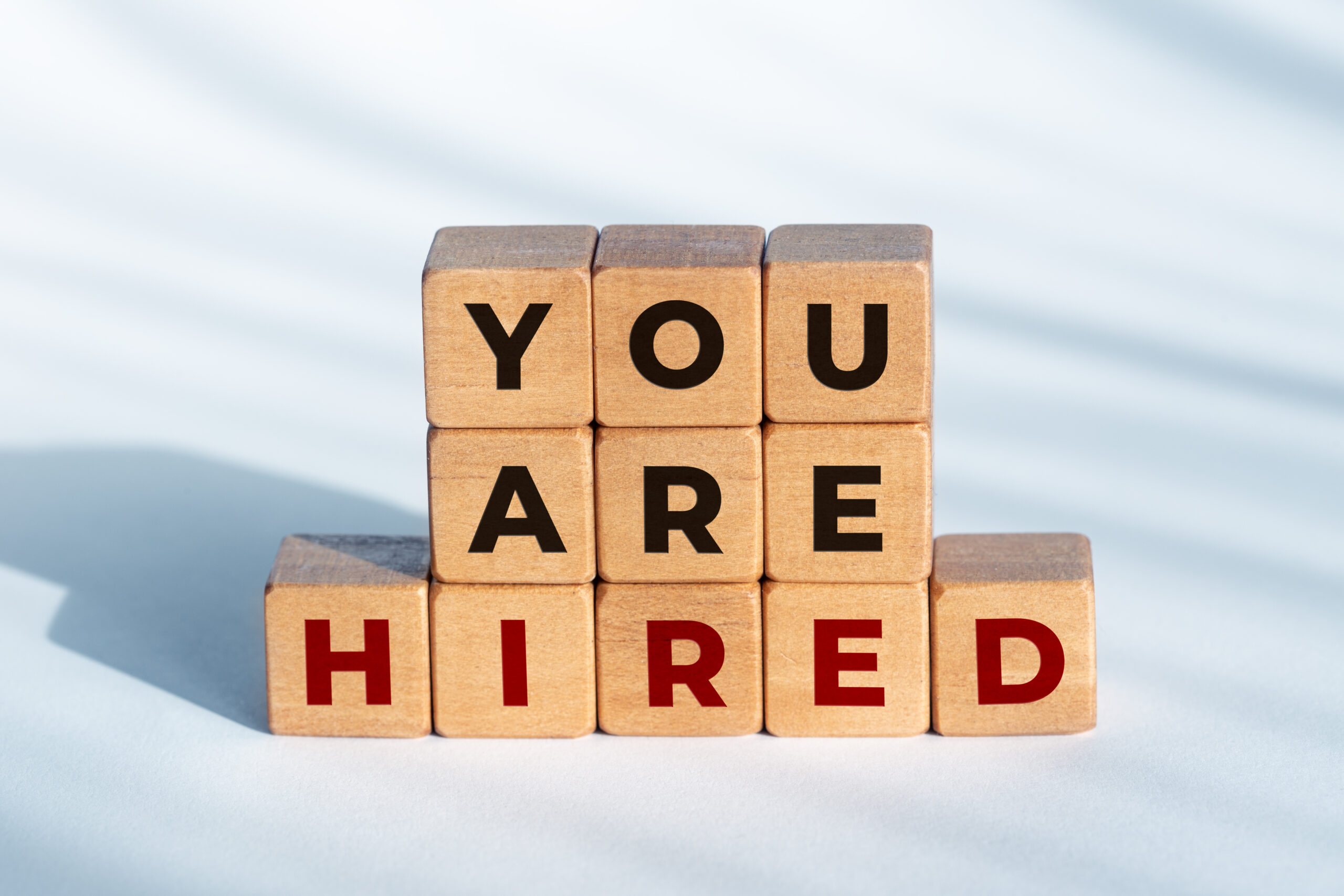 The letter blocks composed the phrase "You are hired".